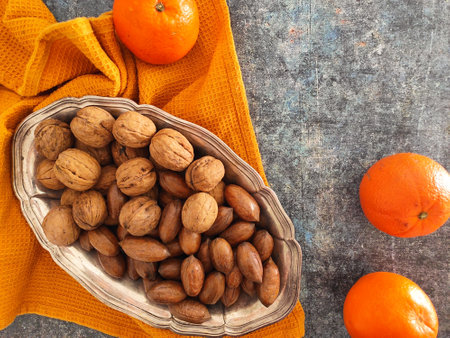 Orange and mixed nuts to enjoy an healthy snackの写真素材