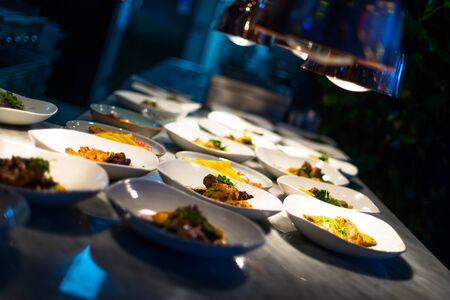 Table served with various dishes and appetizersの写真素材