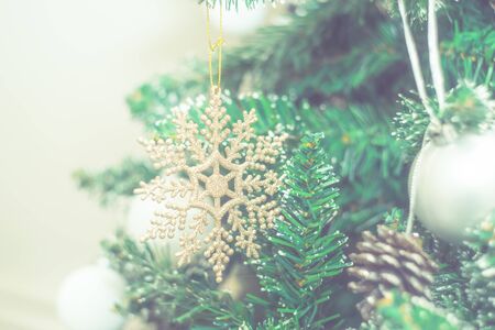 Christmas closeup macro photo with holiday decorations, fir branches and festive bokeh lightingの写真素材