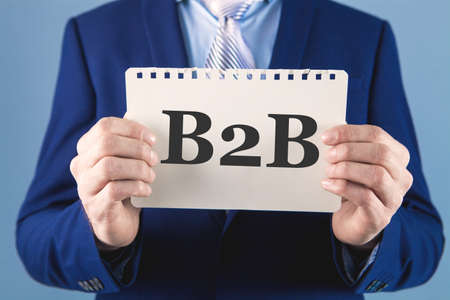 businessman holding paper with text B2bの写真素材