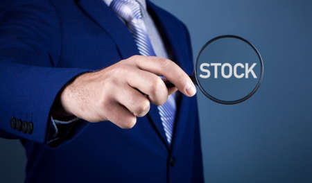 businessman focuses on stockの写真素材
