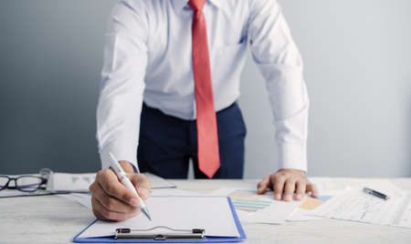 a businessman works at his office; business analysis