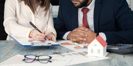 business team discussing real estate sales schedulesの写真素材