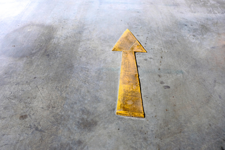 Yellow arrow symbol on the street.の写真素材