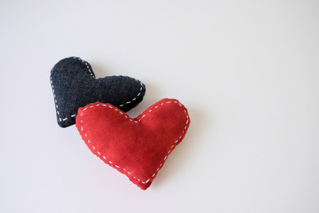 Two hearts are placed on a white background.の写真素材