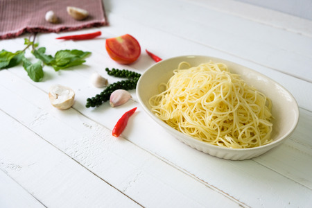 Spaghetti  is suitable for those who want to lose weight. A spicy taste is placed on the white table.の写真素材