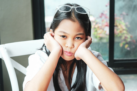 The women sit dismal because the homework is not finished.の写真素材