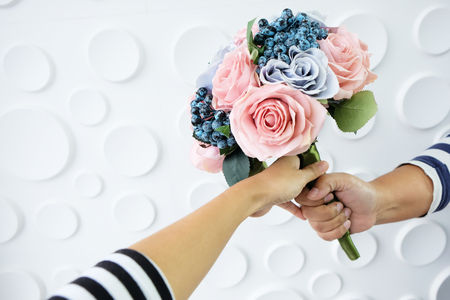 bouquet of  flowers in hand on white backgroundの写真素材