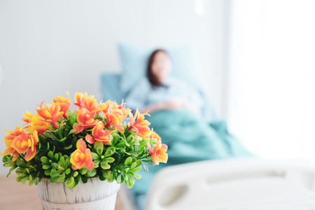 Orange flowers bring patients visit.の写真素材