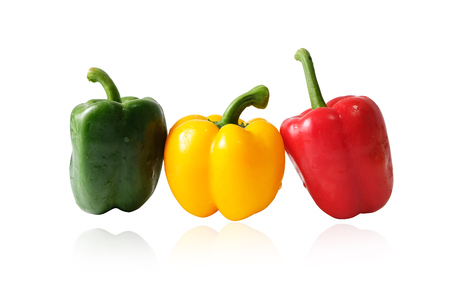 Fresh vegetables Three sweet Red, Yellow, Green Peppers isolated on white backgroundの写真素材
