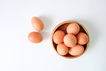Fresh eggs from the farm placed on a white wooden table backgroundの写真素材