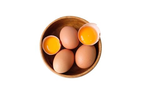 Organic eggs placed in a wooden bowの写真素材