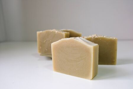 Natural oatmeal soap is placed on a white background.の写真素材