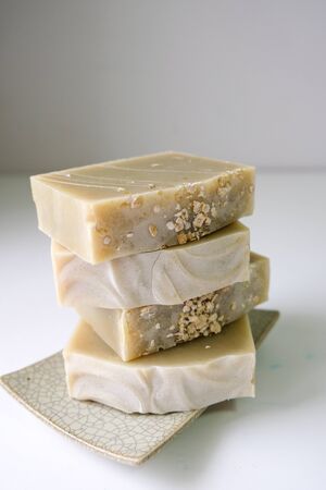 Natural oatmeal soap is placed on a white background.の写真素材