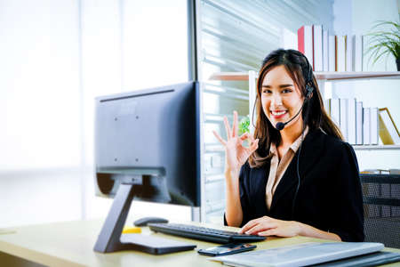 Woman wearing headset working in customer care support service Professional helpline call center...