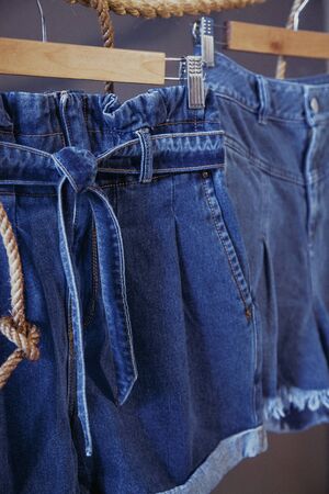Women's denim shorts with beltの写真素材