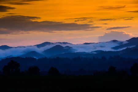 Sunset in mountains sky twilightの写真素材