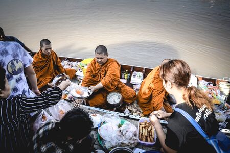 OCT 10: 2017 When the End of Buddhist Lent Day come, The Buddhist give food offerings to Buddhist monks,The Chao Phraya River Waterfront community in Thailand.のeditorial素材