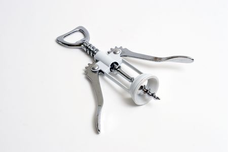 Silver cork screw on a white backgroundの写真素材