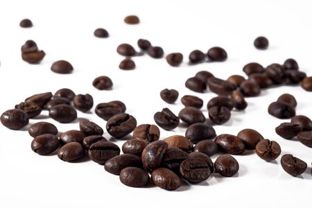 Heap of fresh roasted coffee beans isolated on white background as package design elementsの写真素材
