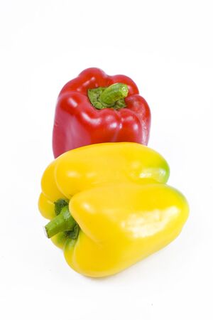 Red And yellow peppers isolated on white backgroundの写真素材