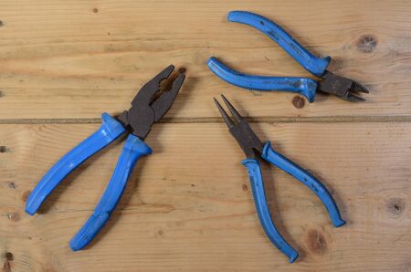 set of pliers on the wooden floor