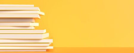 Yellow books isolated on yellow background with copy space. Creative background for education or...