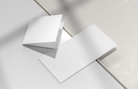 Square bifold brochure mock up isolated on white background. 3D illustration.の写真素材