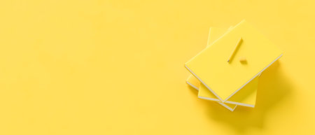 Yellow books isolated on yellow background. Back to school concept design background. 3D illustration.の写真素材