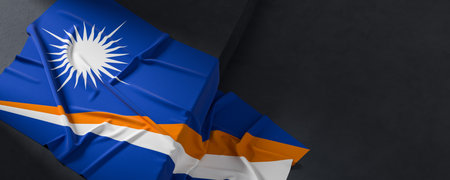 Flag of Marshall Islands. Fabric textured Marshall Islands flag isolated on dark background. 3D...