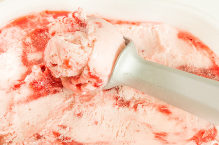 Strawberry icecream with straberry jam and scoop, selective focusの写真素材