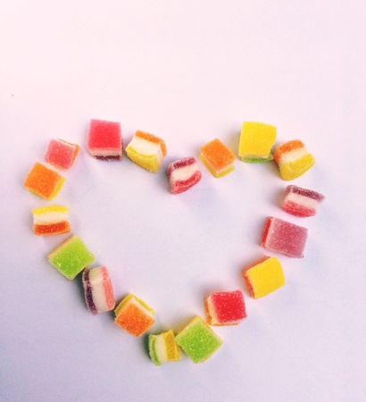 A heart shape made from jelly marshmallow coated by sugar.の素材