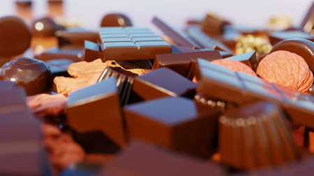 Chocolate pieces, shavings, candy, nut and cocoa beans on wooden backgroundの写真素材