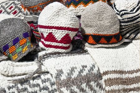 closeup of handmade woolen hats and sweatersの写真素材