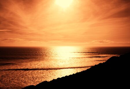 dark red evening light over sea. の写真素材