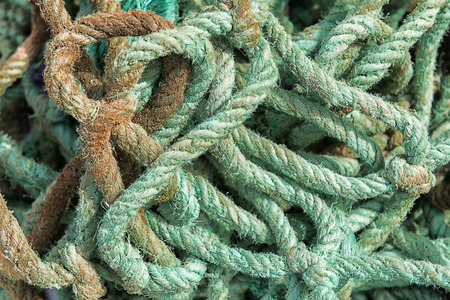Abstract dirty, old, green rope closeup.