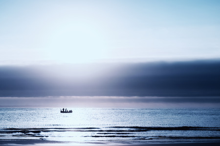 Fisherman in a fishing boat at sea.の写真素材
