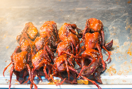 Grilled quail (quail to its small size. Used to make a variety of dishes, whether grilled, fried and delicious) Placed in the tray for sale.の写真素材