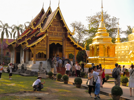 Chiang Mai, Thailand - February 4 2018: A group of tourists are visiting and photographing the Wat Phra Singh.のeditorial素材