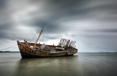 An old shipwreck or abandoned shipwreck. , Wrecked boat abandoned stand on beach or Shipwrecked off the coast of Thailand.の写真素材