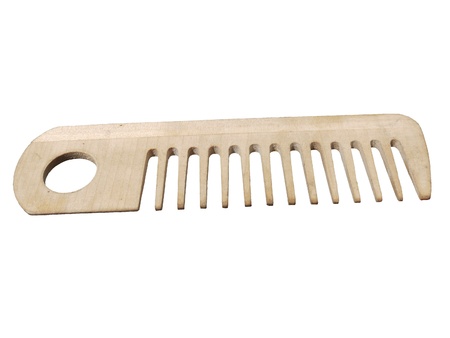 photo wooden comb isolated on a white background 