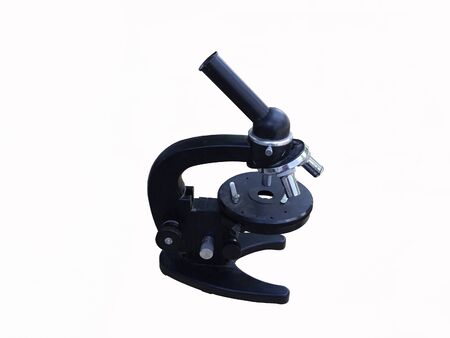 Photo of an old microscope isolated on a white backgroundの写真素材