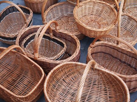 The photo of many baskets of willow twigs