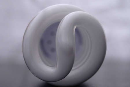 A close-up shot of the coils of a fluorescent bulb.