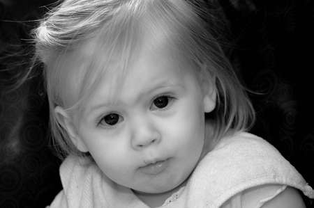 A  with a serious expression on her face.の写真素材