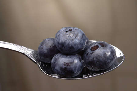 Blueberries on a spoon.の写真素材