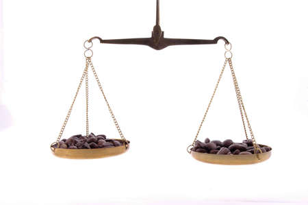 Coffee beans on a balance scale.の写真素材