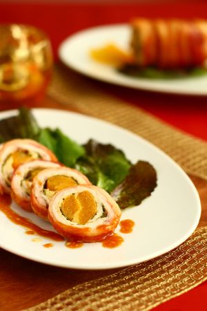 Turkey breast rolls (roulades) with abricot wrapped in bacon の写真素材