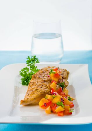 chicken breast with mango salsa の写真素材