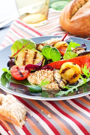 Grilled vegetables and chicken with sesame seedsの写真素材